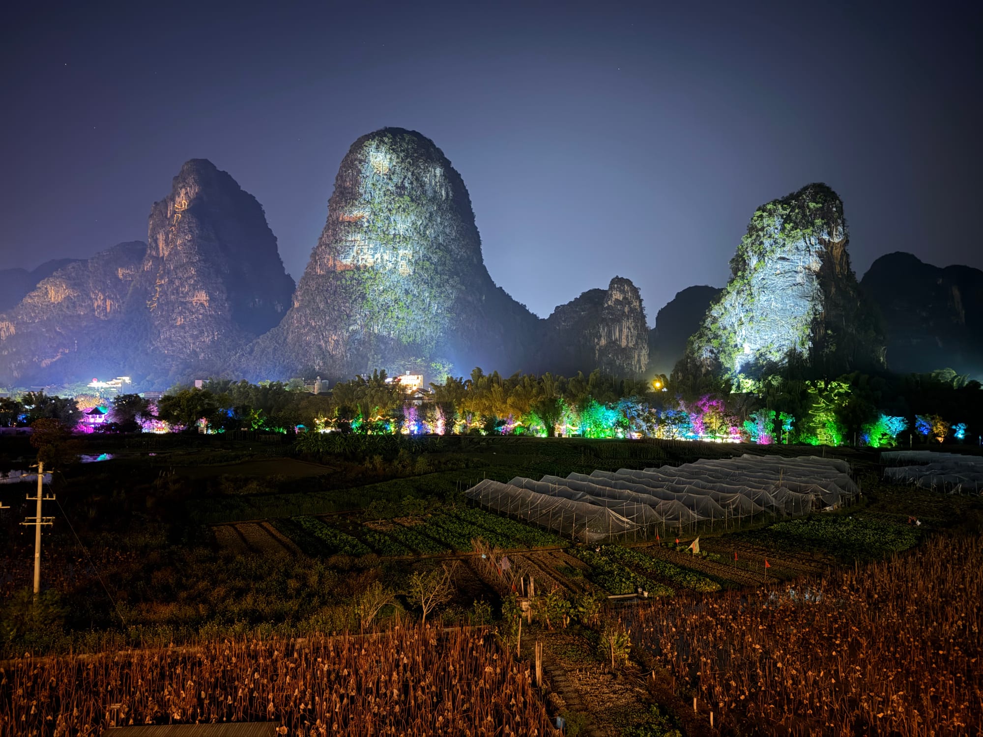 Trip photo: the karst hills lit up at night, seen from the Yangshuo hotel balcony