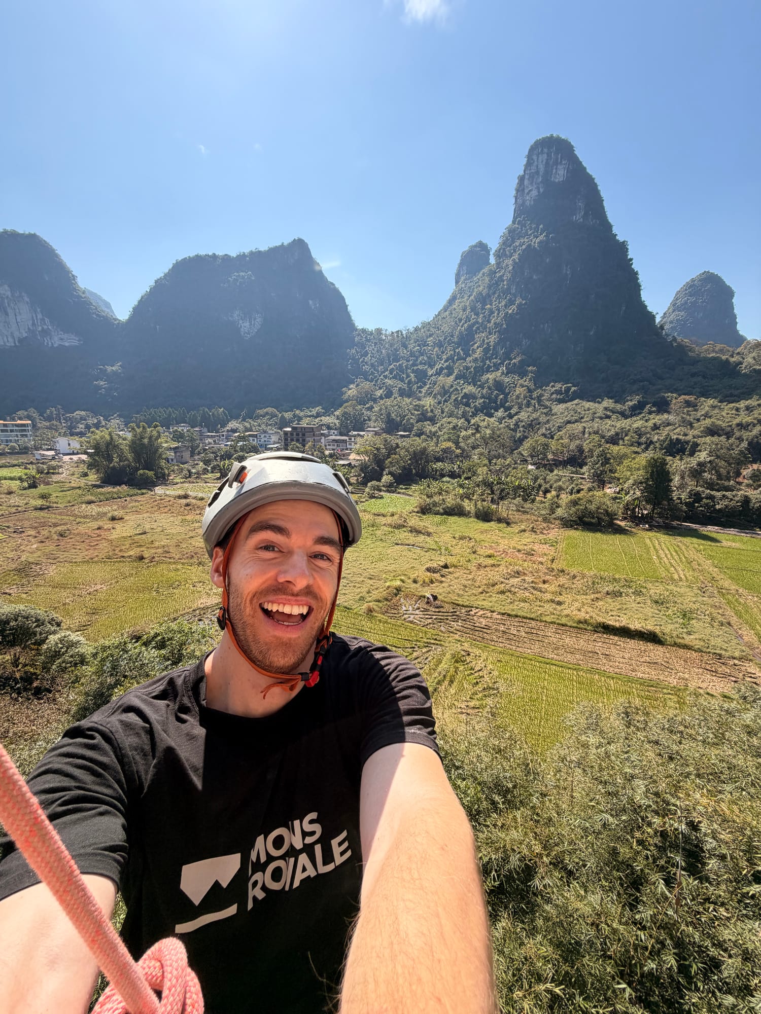Trip photo: top-rope climbing selfie under the karst outside Yangshuo