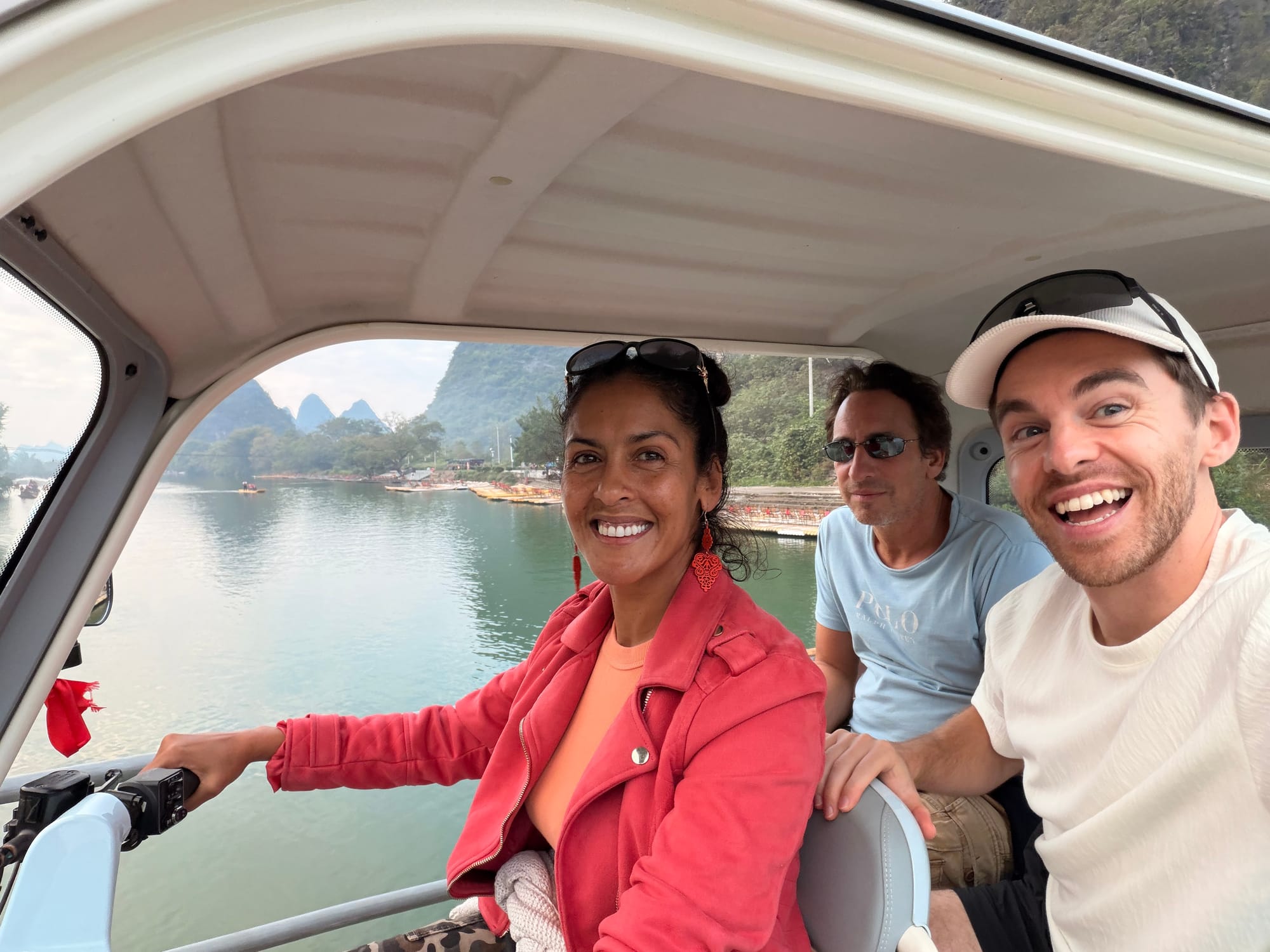 Trip photo: the rented electric rickshaw crew on the Li River backroads at golden hour
