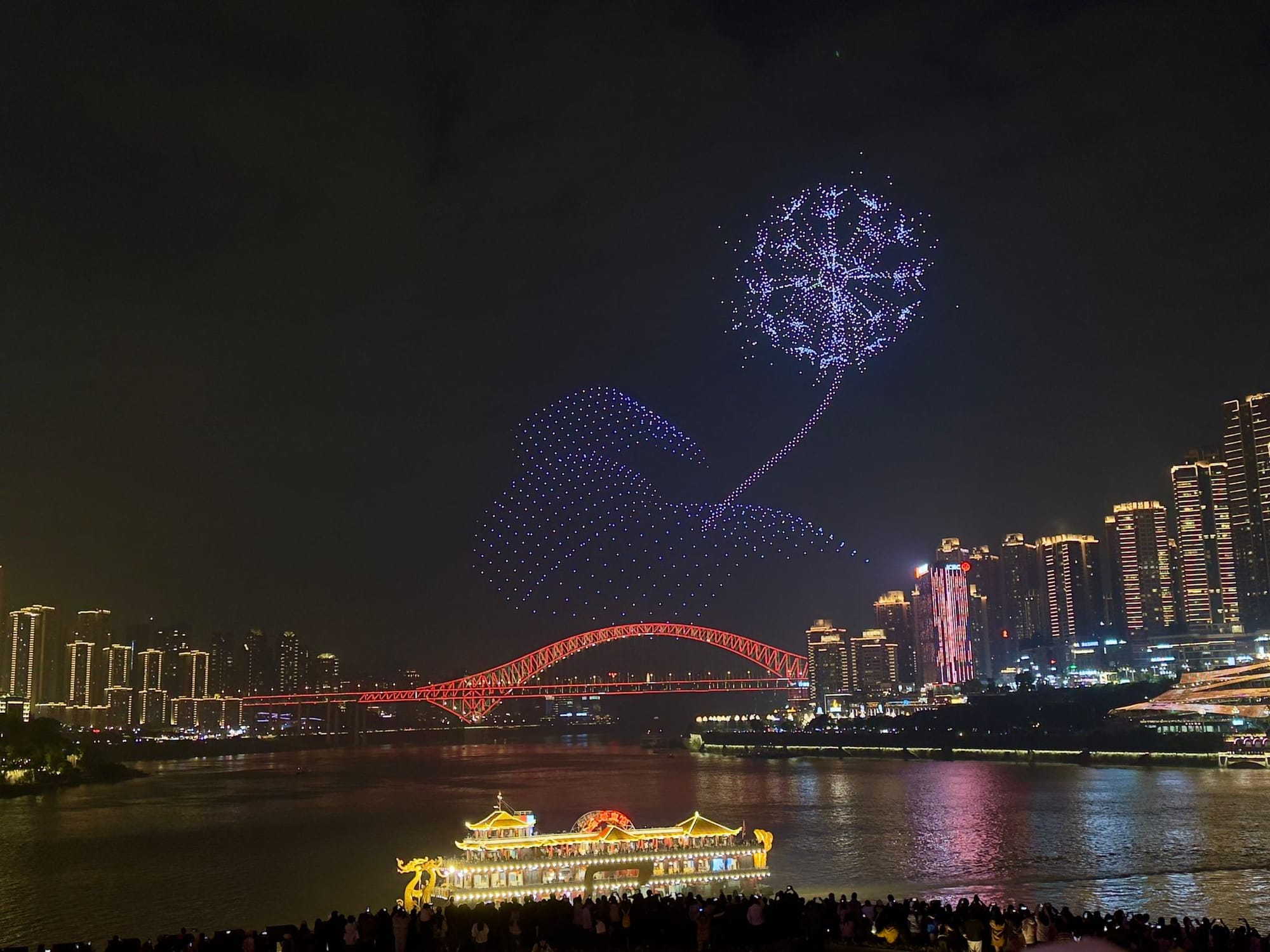 Trip photo: the Saturday-only drone show we sprinted off the train for. The unicorn came later