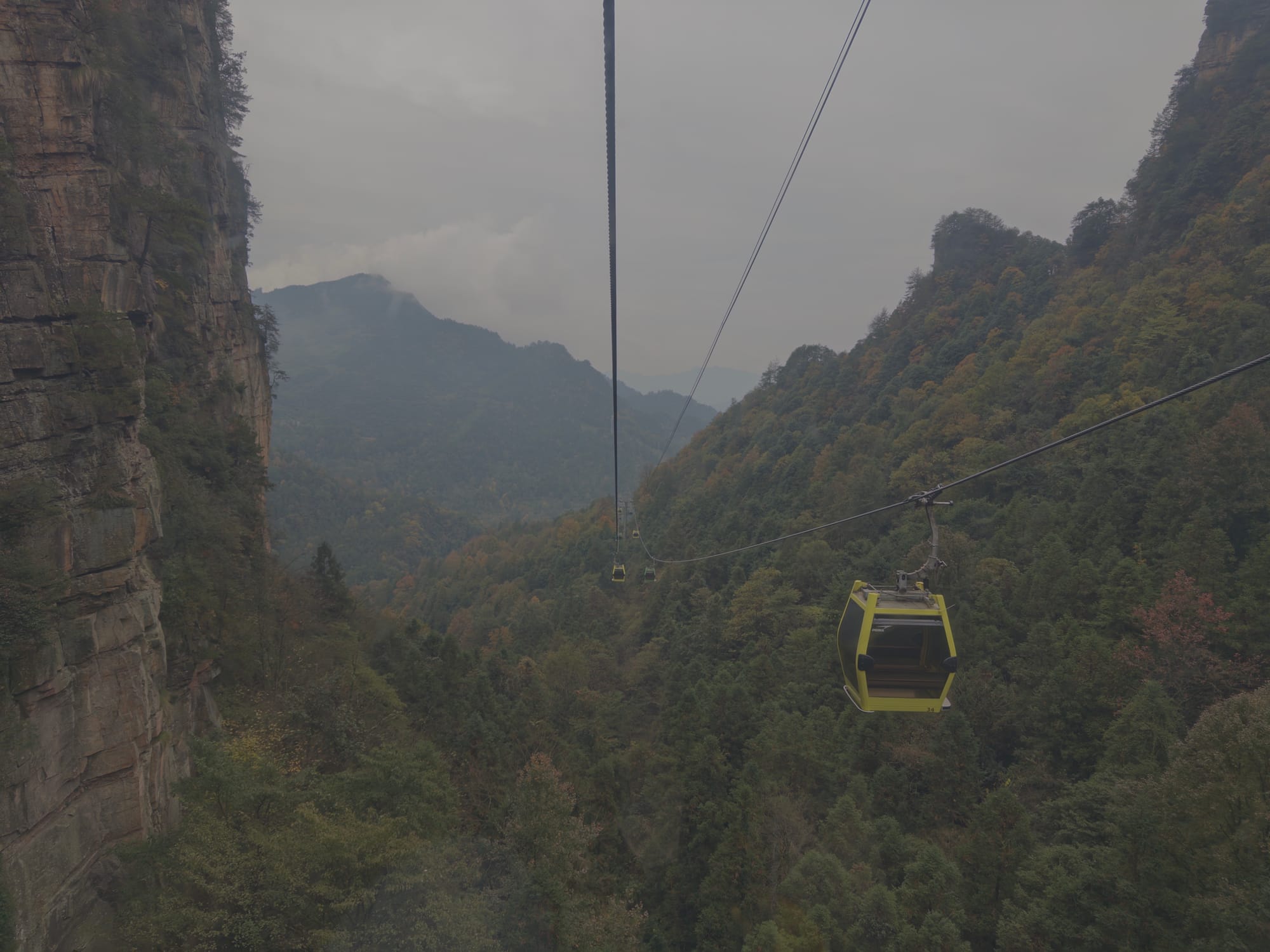Trip photo: the final gondola down into the misty pillars, the genuinely epic part of the transport pass