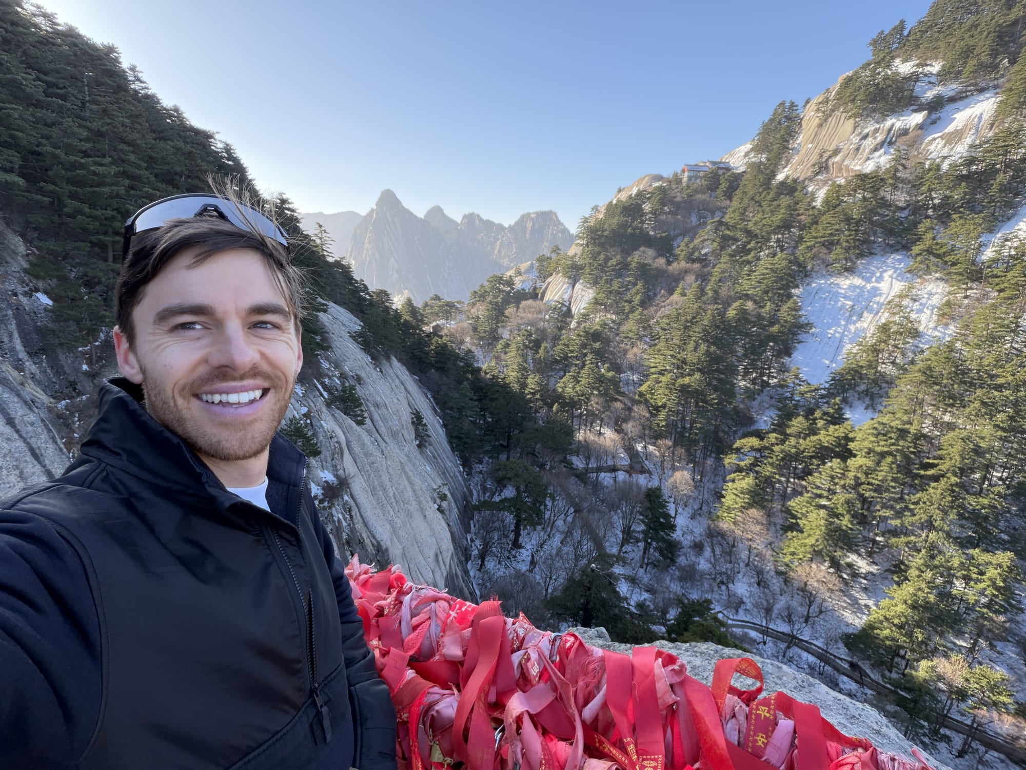 Trip photo: red prayer ribbons on the way up Huashan, nobody else in frame