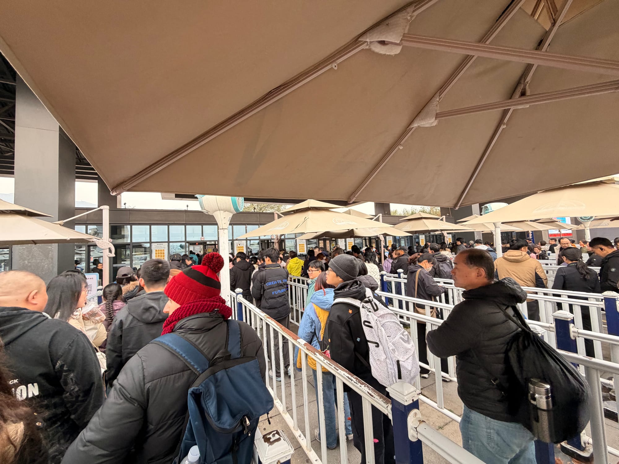 Trip photo: the umbrella queue at the Terracotta Warriors gate. Everyone in China is here